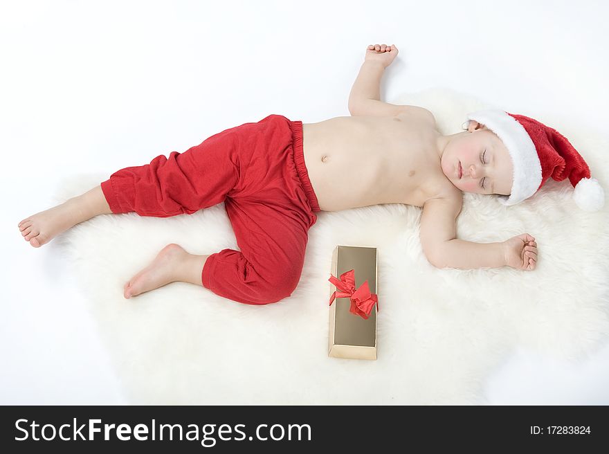 Baby In Christmas Suit Is Sleeping