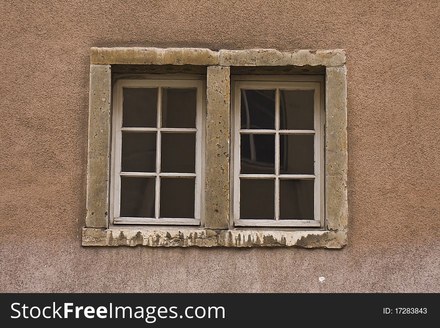 Old double window on wall