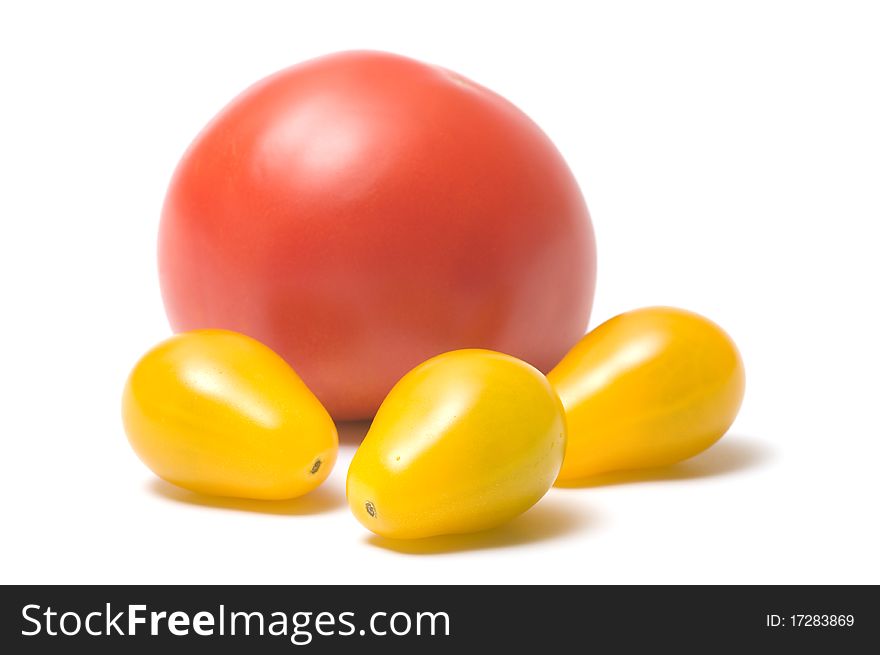Yellow and red tomatoes isolated on white background. Yellow and red tomatoes isolated on white background.