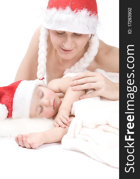 Mother And Sleeping Baby Wearing Christmas Hut