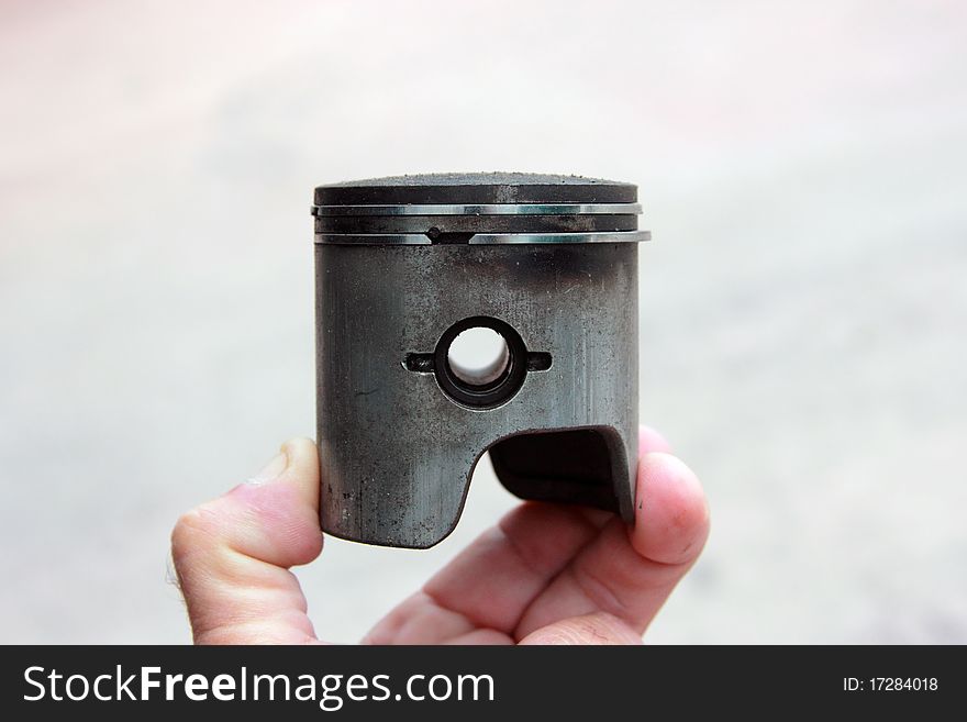 Close up of the old worn piston