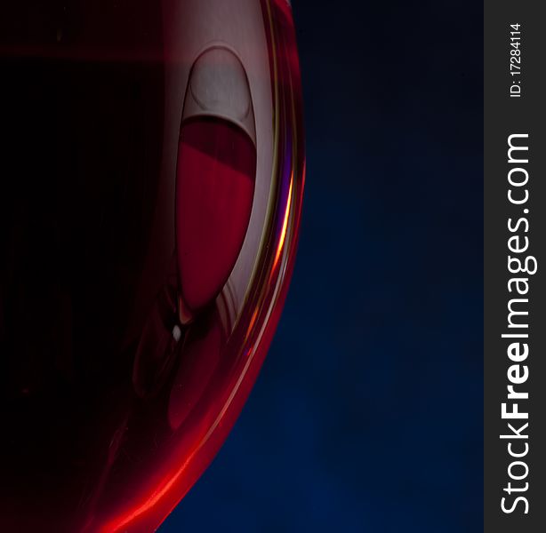 Red wine on the black background