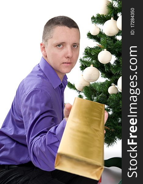 Man Under Christmas Tree Is Giving A Gift