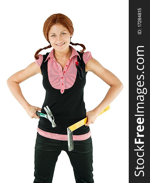 Smiling redhead with braids and braces standing and holding claw hammer and octant in hands. Smiling redhead with braids and braces standing and holding claw hammer and octant in hands