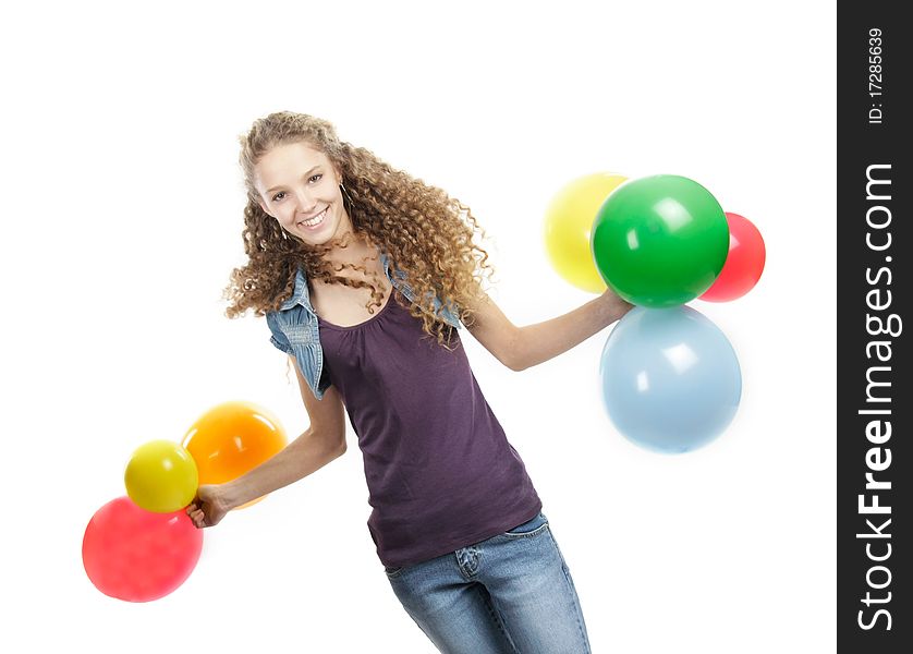 Studio portrait of young happy girl with colorful balloons over white