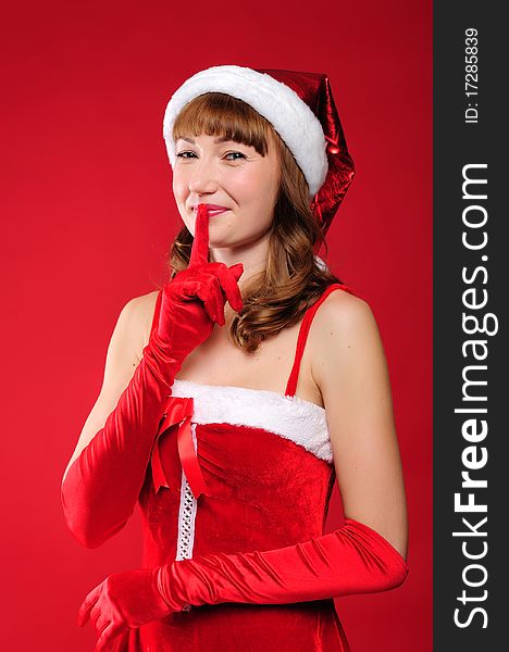 Portrait of a young charming girl dressed as Santa. Happy New Year!