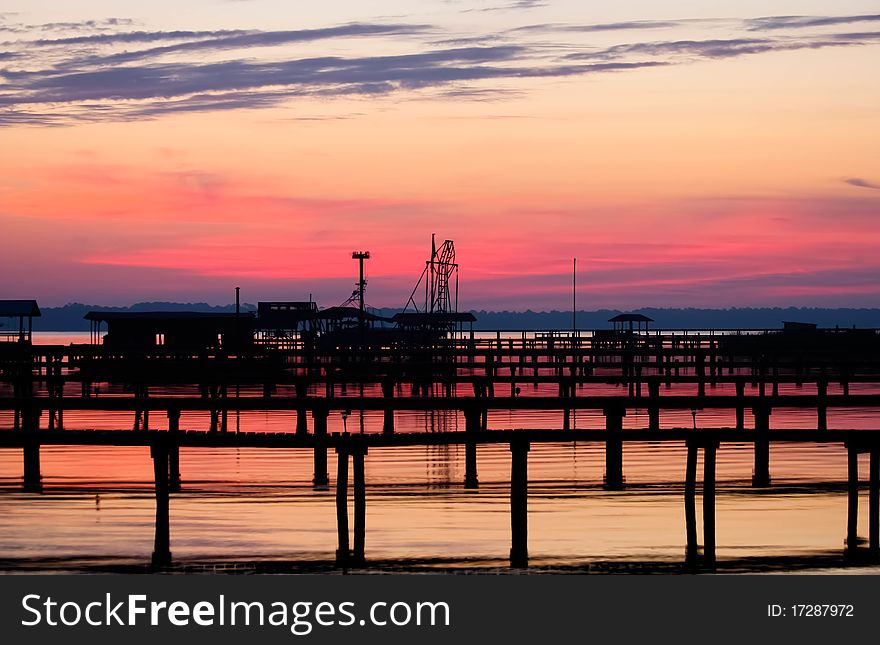 Colorful sunrise over a river filled with docks. Colorful sunrise over a river filled with docks