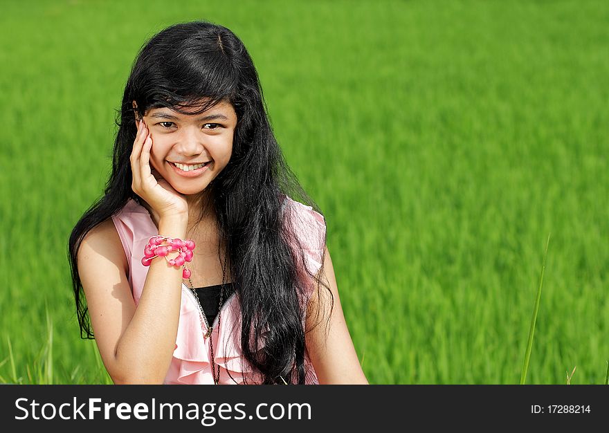 Beautiful smiling of teenage girl in green nature. Beautiful smiling of teenage girl in green nature
