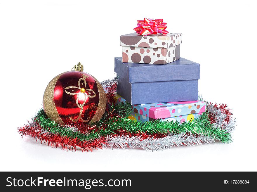 A pile Christmas ball and gifts isolated on white background. A pile Christmas ball and gifts isolated on white background.