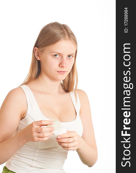 Portrait of young woman closing deodorant