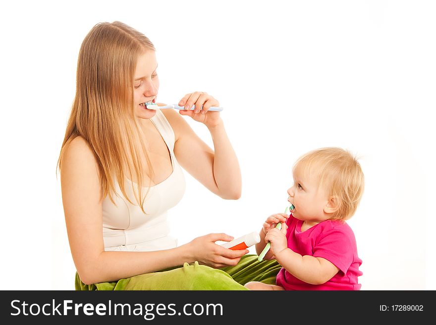 Woman And Girl Brushing Tooth