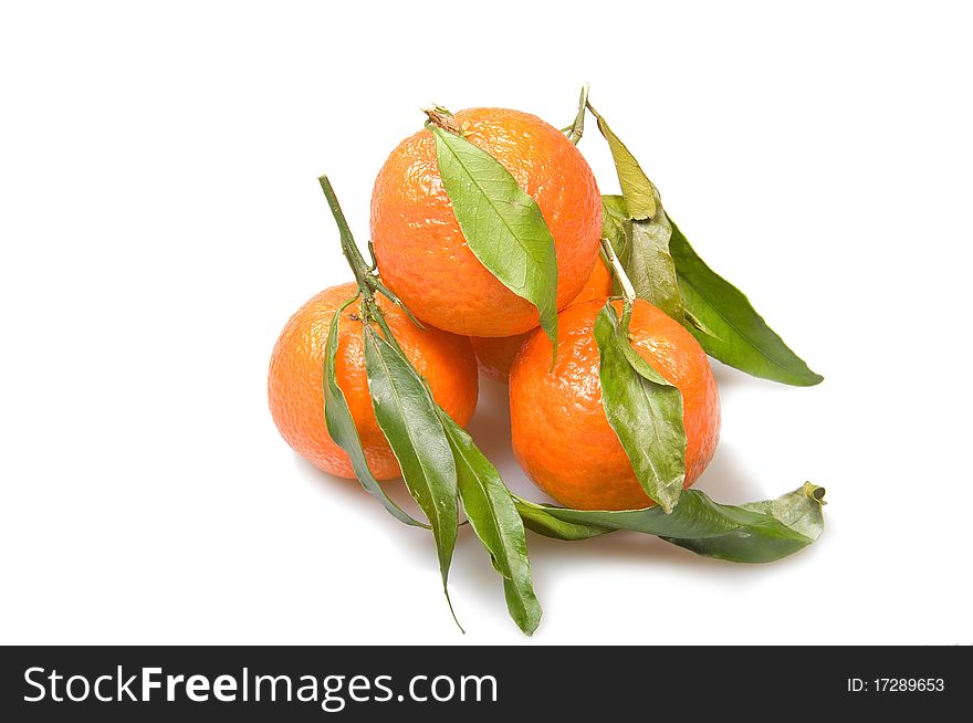 Mandarin with a leaf isolated over white background