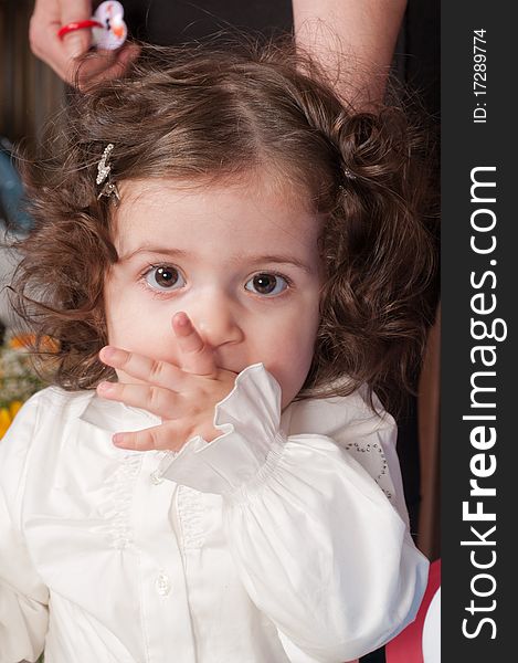 The little girl with the big expressive eyes and wavy hair. The little girl with the big expressive eyes and wavy hair.