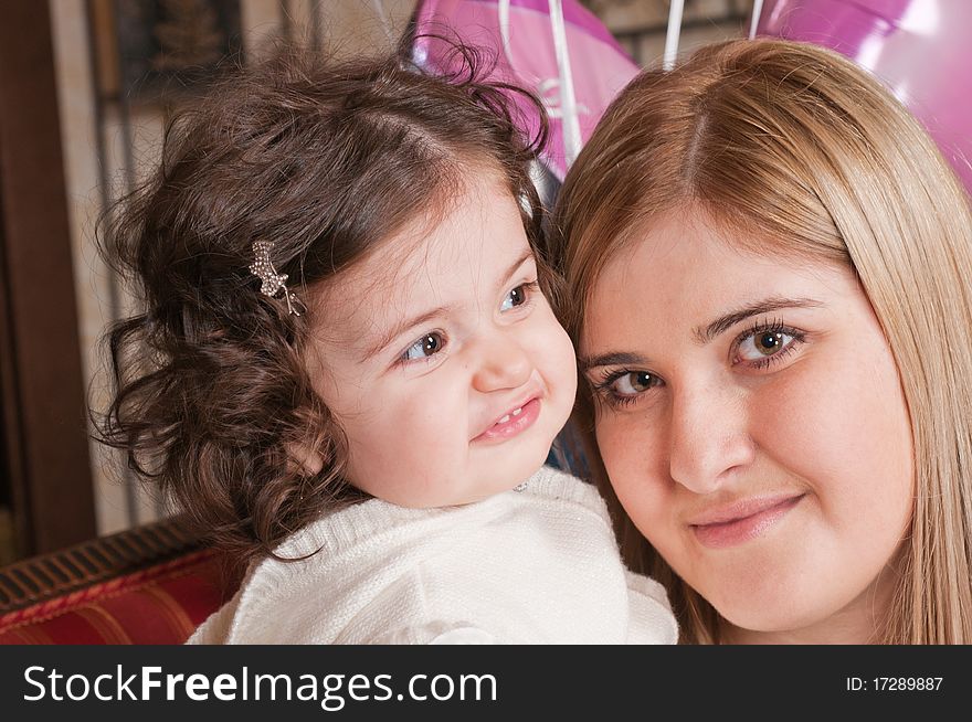 The happy woman holds the small daughter on hands. The happy woman holds the small daughter on hands.