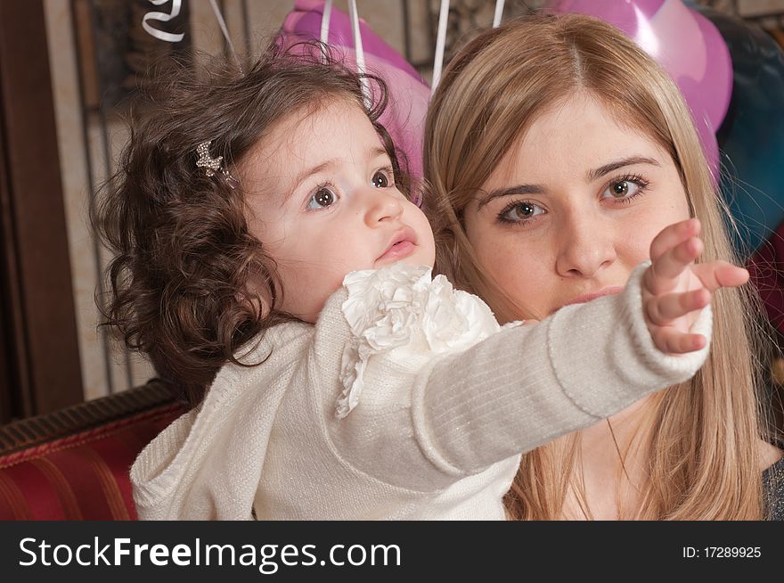 The happy woman holds the small daughter on hands. The happy woman holds the small daughter on hands.