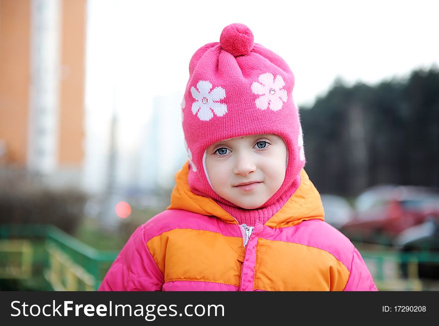 Portrait of small girl in warm pink hat. Portrait of small girl in warm pink hat