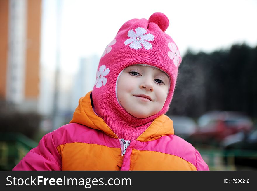 Portrait of small girl in warm pink hat. Portrait of small girl in warm pink hat