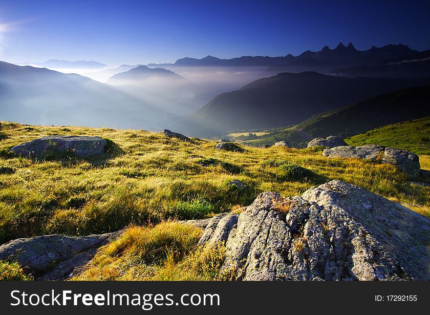 View over Aiguilles d'arve in oisans near the Guichard lake by a sunny day, France. Magic light. View over Aiguilles d'arve in oisans near the Guichard lake by a sunny day, France. Magic light.