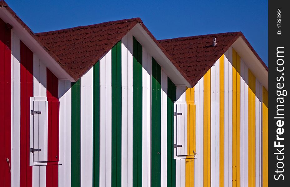 Coloured bathing huts on Alicante Beach. Coloured bathing huts on Alicante Beach