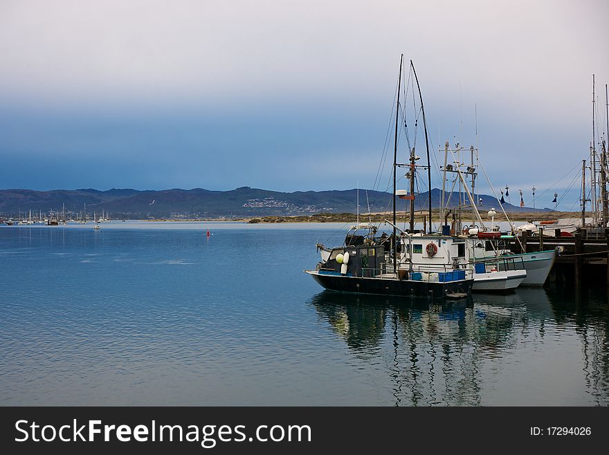 Fishing boats harbored in Morro Bay, California. Fishing boats harbored in Morro Bay, California.
