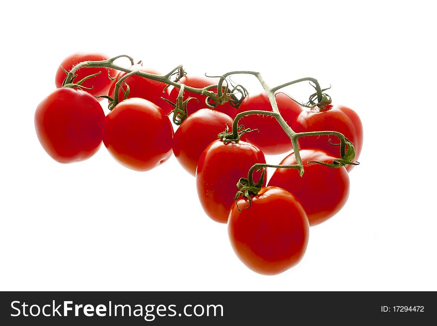 Some cherrytomatoes isolated over white