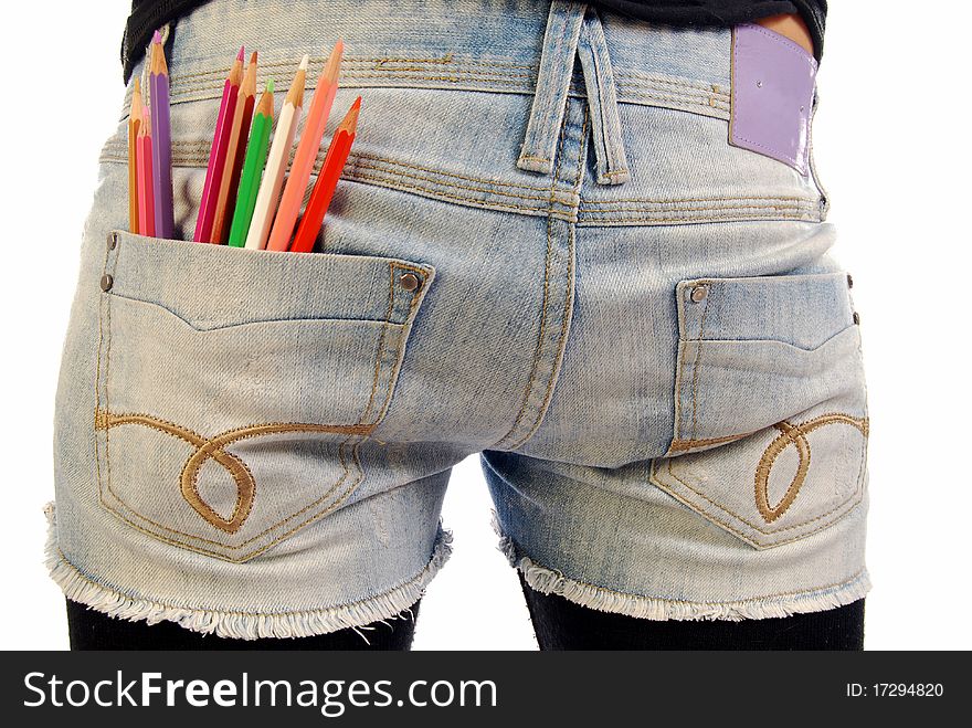 A girl with a set of colored pencils in the pocket of Jeans