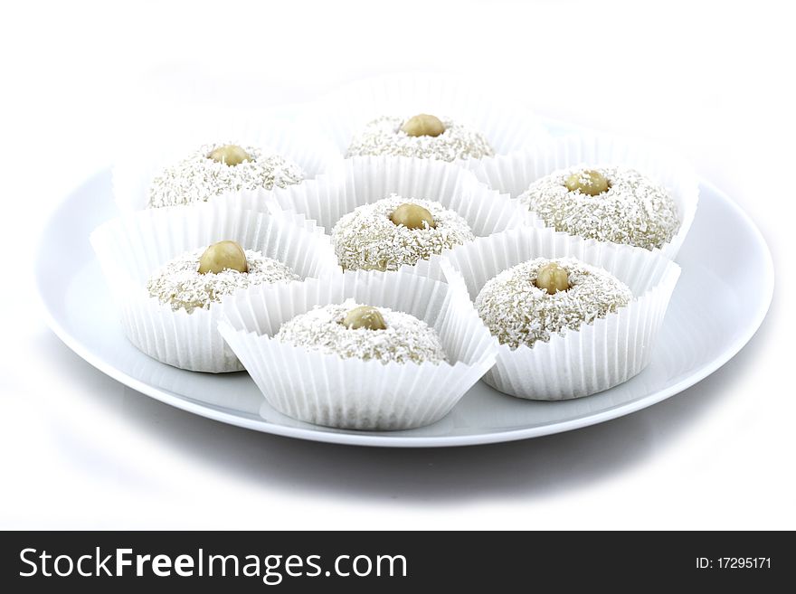 Coconut short cake with almonds on white background. Coconut short cake with almonds on white background