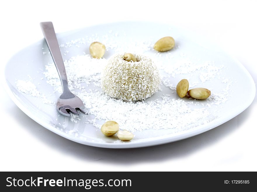 Coconut short cake with almonds on white background. Coconut short cake with almonds on white background