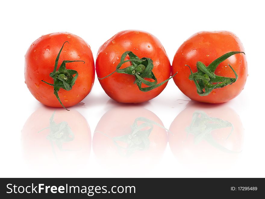 Closeup view of three tomatoes isolated on the white