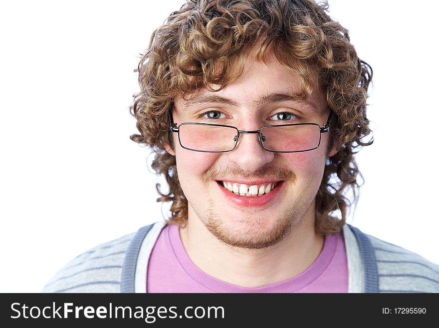 Portrait of a handsome young man in glasses with curly hair. Portrait of a handsome young man in glasses with curly hair