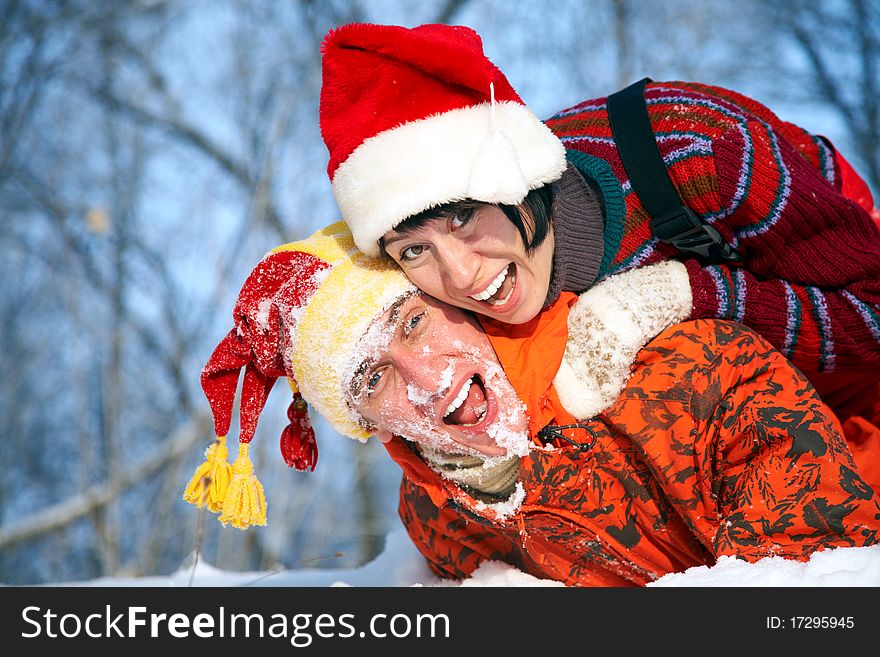 Young family plays winter wood on snow. Young family plays winter wood on snow