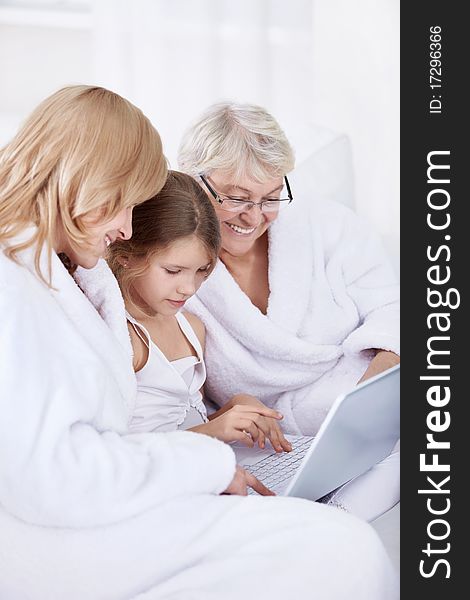 Grandmother, mother and daughter with laptop. Grandmother, mother and daughter with laptop