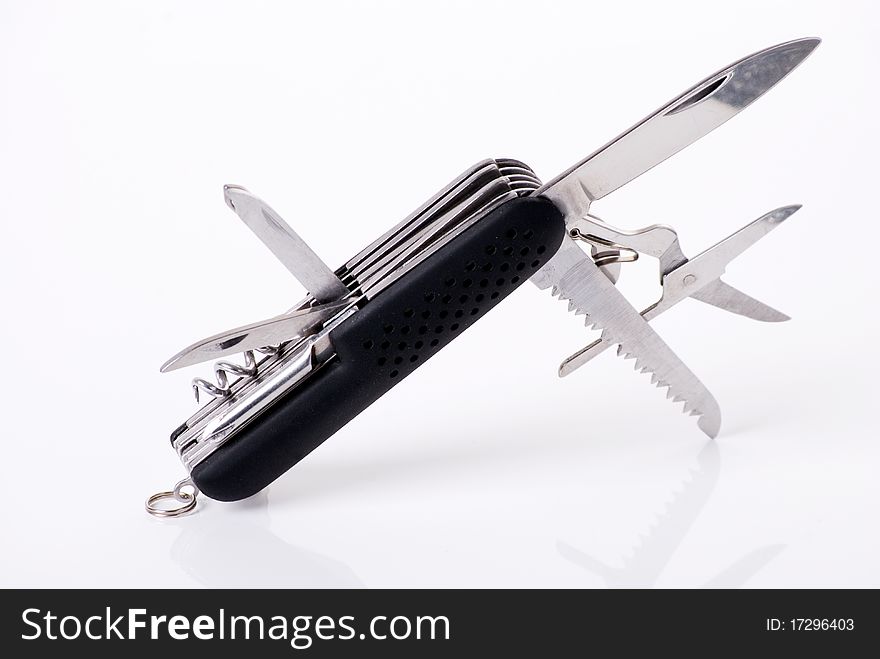 An image of a multitool knife with various attachments opened isolated against a white background