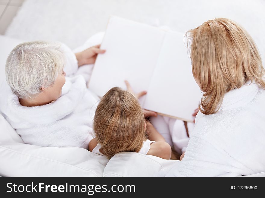 Family child reads a book. Family child reads a book