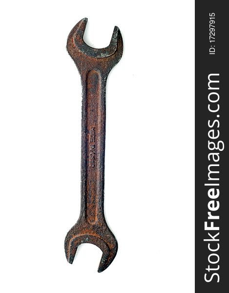 Old rust spanner isolated on white background