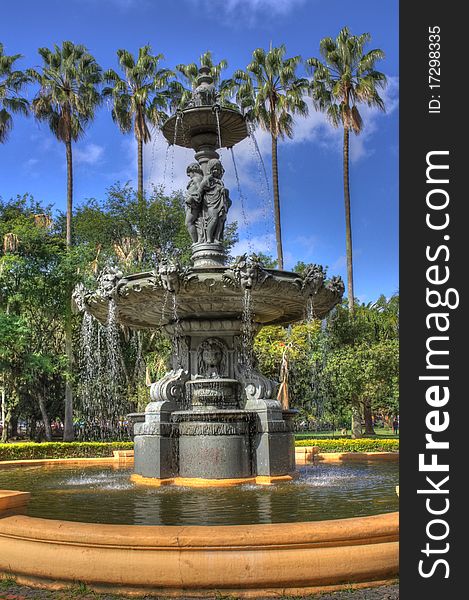 Gargoylian fountain, HDR image, high resolution. Angels, palms, sky, high depth of details and textures.