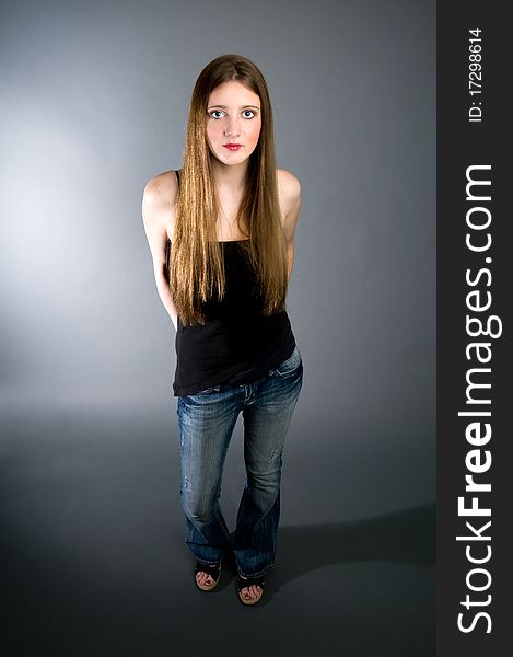 Teen model with black tank top and jeans