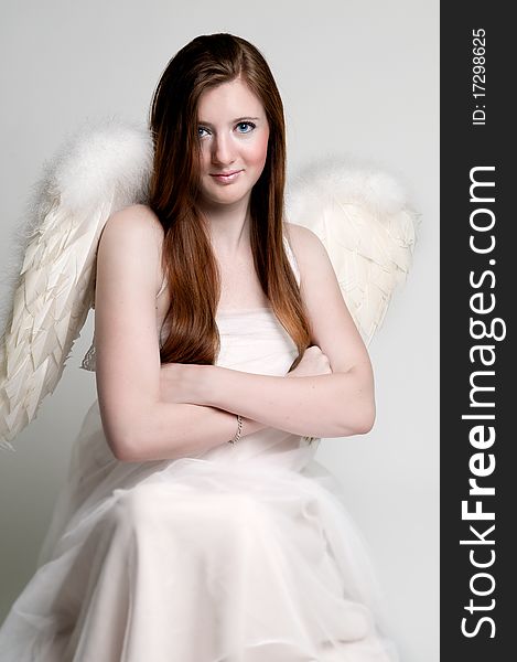 Rebellious angel with arms crossed