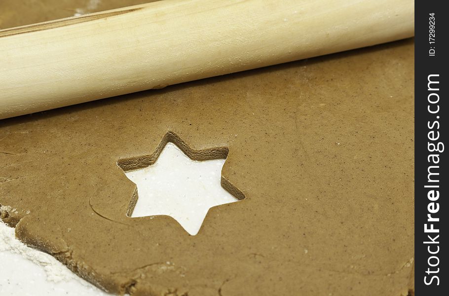 Empty space left after cutting a star shape from cookie dough. Empty space left after cutting a star shape from cookie dough