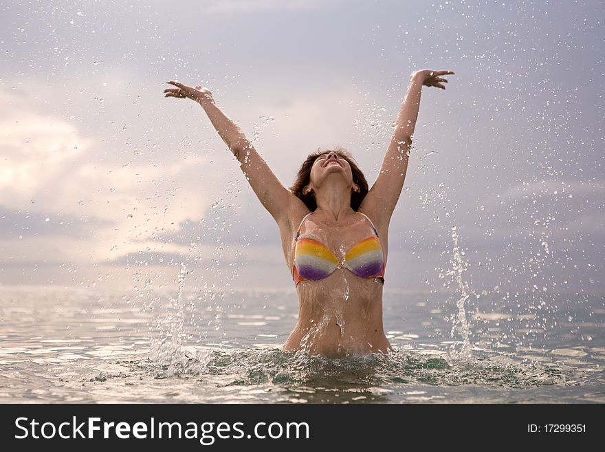 The woman bathing at ocean