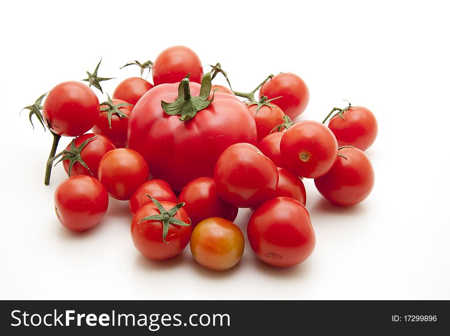 Cocktail tomatoes onto white background