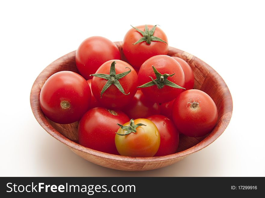 Cocktail tomatoes in wood bowl