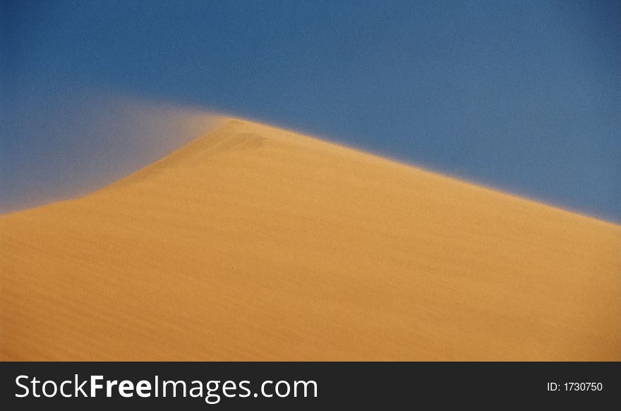 Desert dune during sand storm, Maroc, Africa