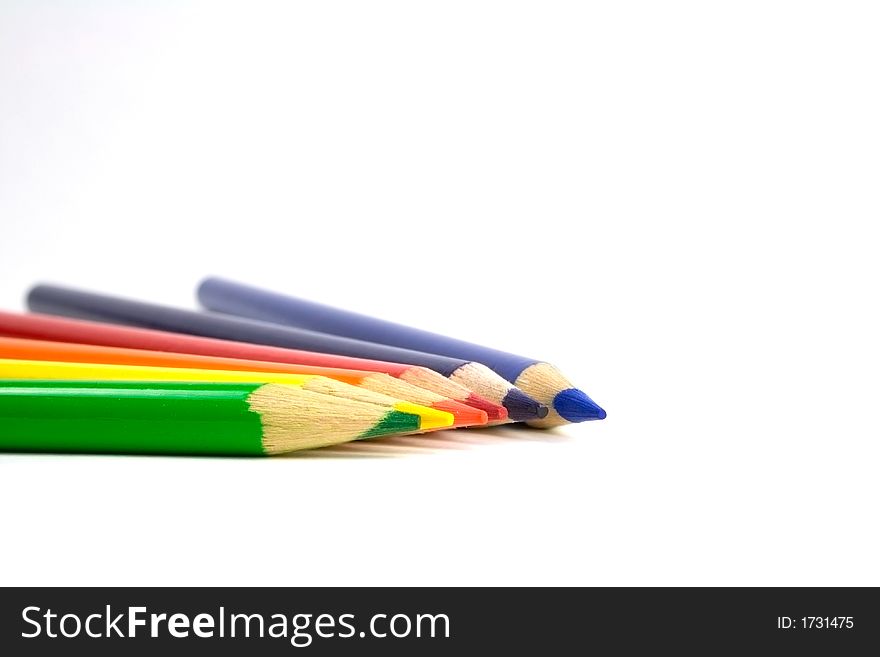 Six colored pencils on a white background