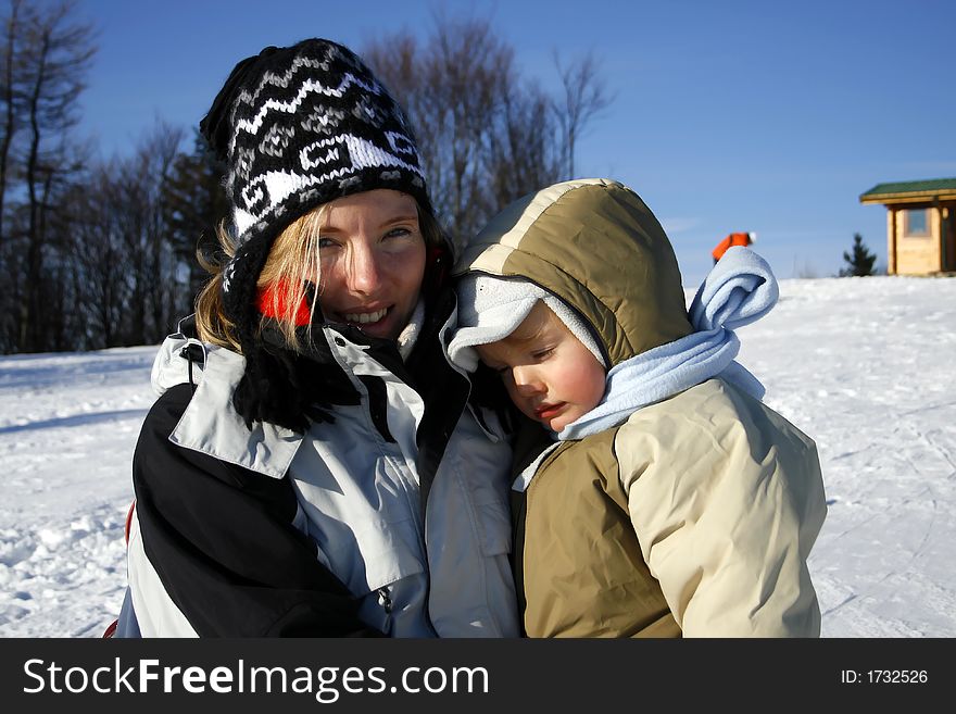 Mother with son in winter time