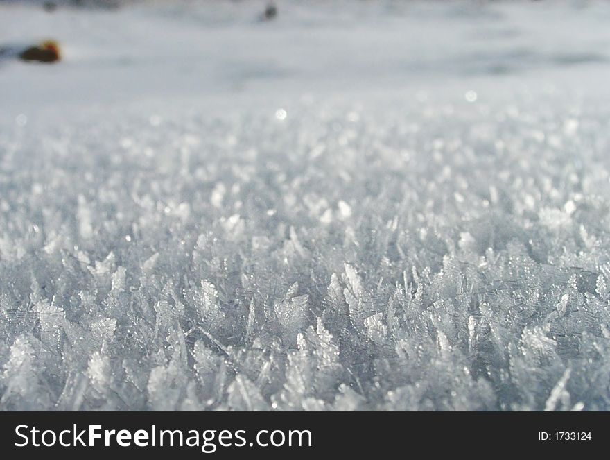 Snow-covered surface of winter mountainside. Snow-covered surface of winter mountainside