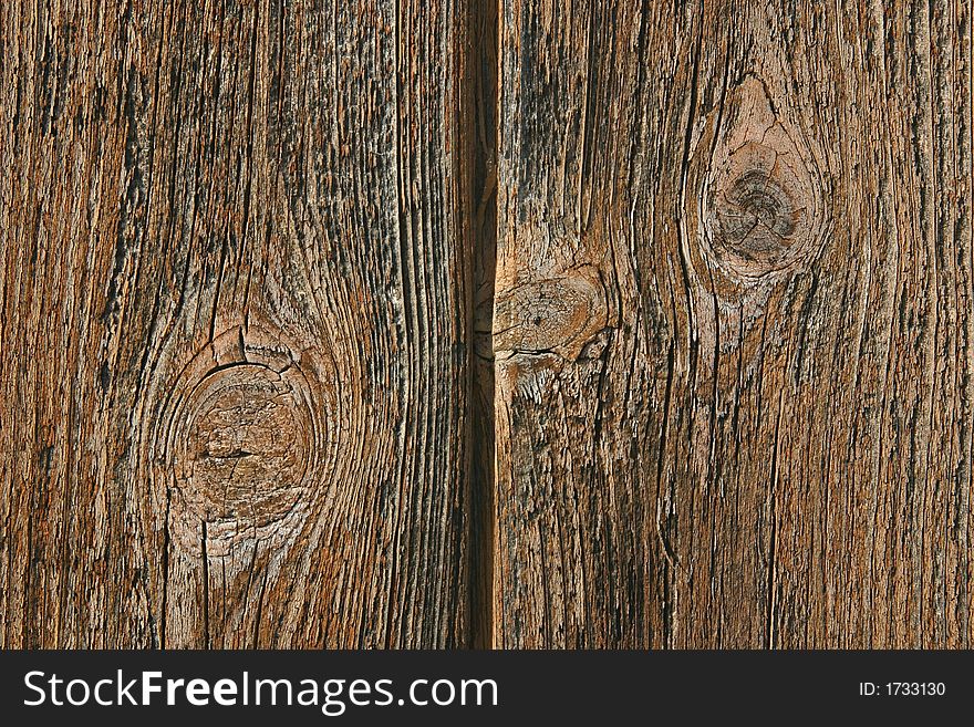 Old wooden weathered planks on a hut. Old wooden weathered planks on a hut