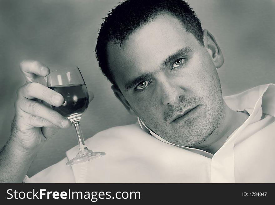 Man holding glass of wine. Man holding glass of wine.