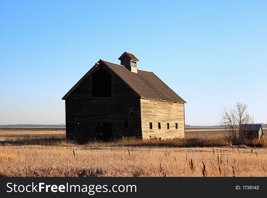 Rustic old barn isolated in the countryside.