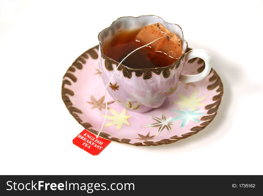 Classic antique tea cup with tea bag. Classic antique tea cup with tea bag.